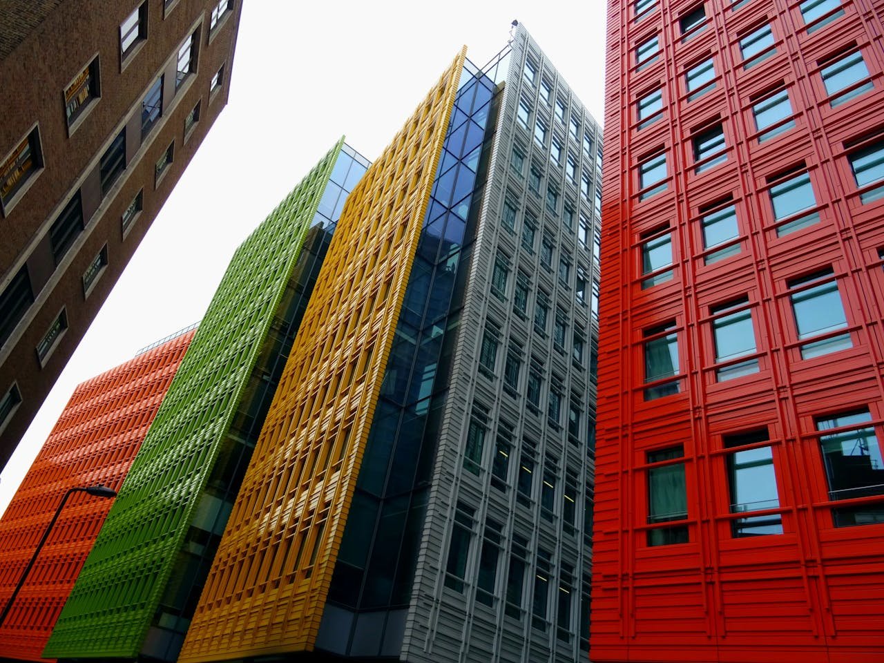 Vibrant colored skyscrapers in a modern cityscape showcasing innovative architecture and design.